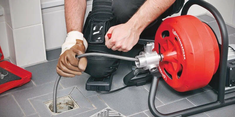 Drain cleaning service in Dunedin, Florida using professional plumbing equipment